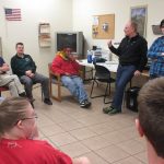 A group of people sitting in a room.