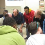A group of people in a room.