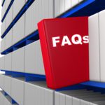 A red book with the word faq on it on a shelf.