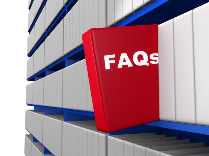 A red book with the word faq on it on a shelf.