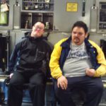 Two men sitting together on the table